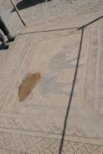 Mosaic of a winner with cup and ribbon