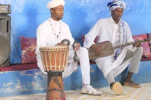 Berber drummer using  cymbals and basist
