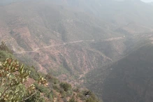 The road winding on other side of valley