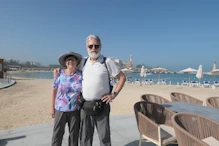 Nick and Robyn with palace behind