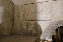 A tomb painting faded by immersion