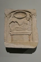 A tombstone of a woman