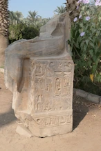 The bottom half of a seated pharaoh