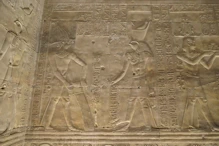 King offering water to Horus