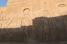 A pharaoh getting gifts from gods