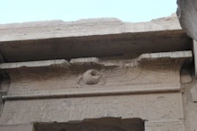 Protective wings and cobras over doorway