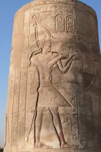 Pillar with a king making n offering