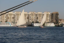 Two feluccas in fromt of new appartment block