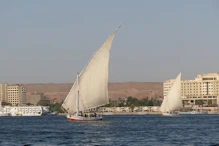 Two feluccas in fromt of new appartment block