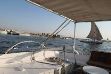 Another one passing by: note auto pilot while adjusting sails