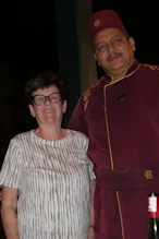 Robyn and a waiter at dinner