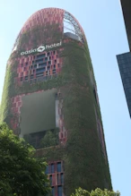 Large building with growth on outside