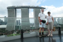 Three buildings joined by a boat on top + Nick + Robyn