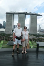 Three buildings joined by a boat on top + Nick + Robyn
