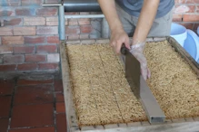 Puffed rice or tapioca + toffee cut into squares