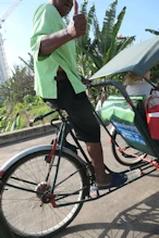 Note the heavy chain on rickshaw