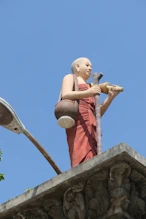 Monk statue on avenue to Buddha