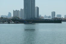 Empty sand barge riding high