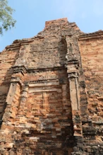 South side of old brick temple with remnant stucco decoration