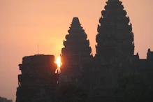 The sun appearing behind main temple