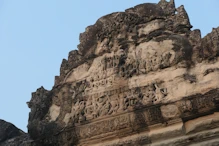 Eroded carvings on edge building