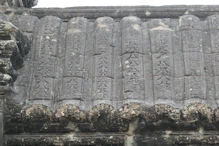 Carvings on vaulted roof over corridor