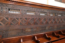 Cathedral interior very old carved wood choir screen