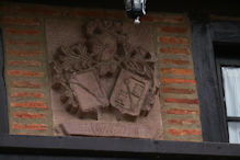 Family shields on building
