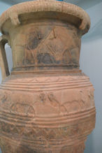 Large pottery vessel with horses and sheep