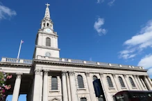 St Martin in the Fields in bright sunshine after a dull morning