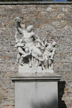Complicated classical sculpture with snake