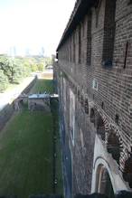View from top of wall over moat + gate