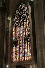 One of the three large stained glass windows at east