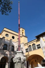 Flag pole + house