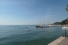 Lots of yachts and a paddle boarder