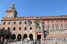 Clock on building at Piazza Maggiore