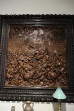 Intricate wooden Basse relief of a battle
