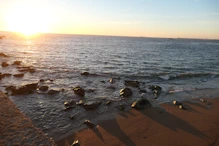 Sunset with light reflected by stones