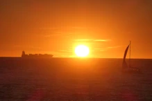 Developing sunset with sailing boat