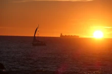 Developing sunset with sailing boat