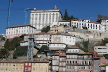 Buildings climbing up bank