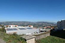 Looking over a supermarket's solar panels to the valley