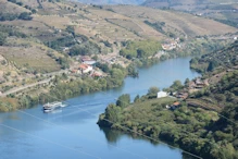 Looking up river with cruise boat