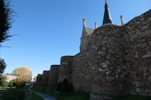 Mostly hidden behind town wall