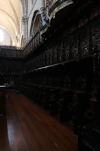 The choir lots of dark carved wood