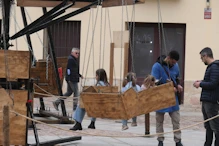A hand-cranked people spinner with a few customers (health and safety?)
