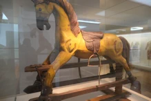 Rocking horse with decorated saddle
