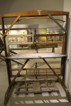A foot powered jigsaw, note wooden spring at top