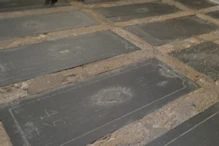 Tomb stones in floor with only a number 
