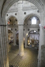 Columns and faces on wall
